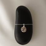 Moon Landing necklace in silver – smelt