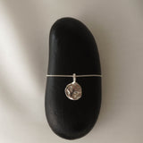 Moon Landing necklace in silver – smelt