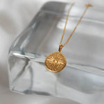 Compass necklace in gold – smelt