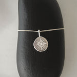 Compass necklace in silver – smelt