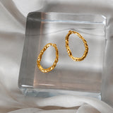 Orbit earrings in gold – smelt